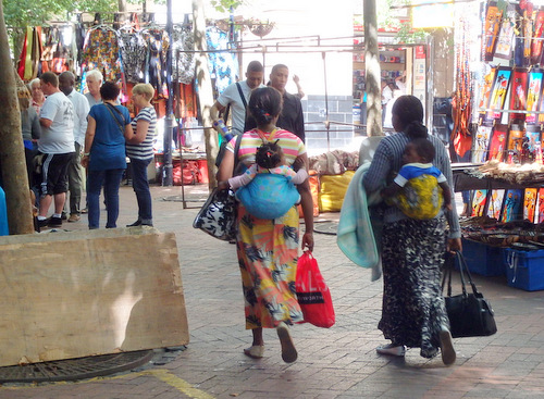 Ladies shopping with kids.